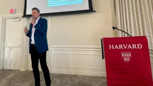 Philippe speaking at the Harvard event